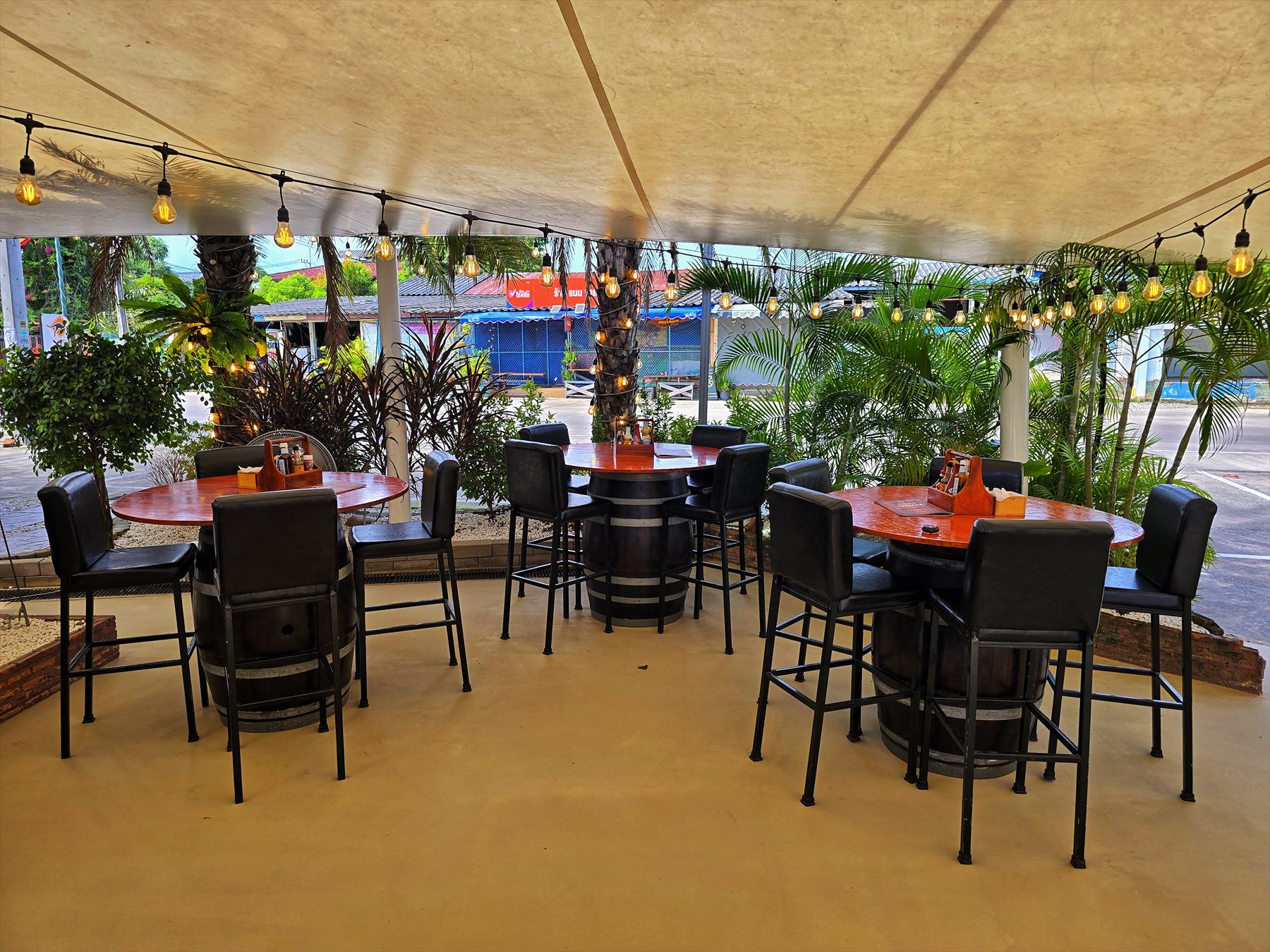 Seating area with plants and warm lighting