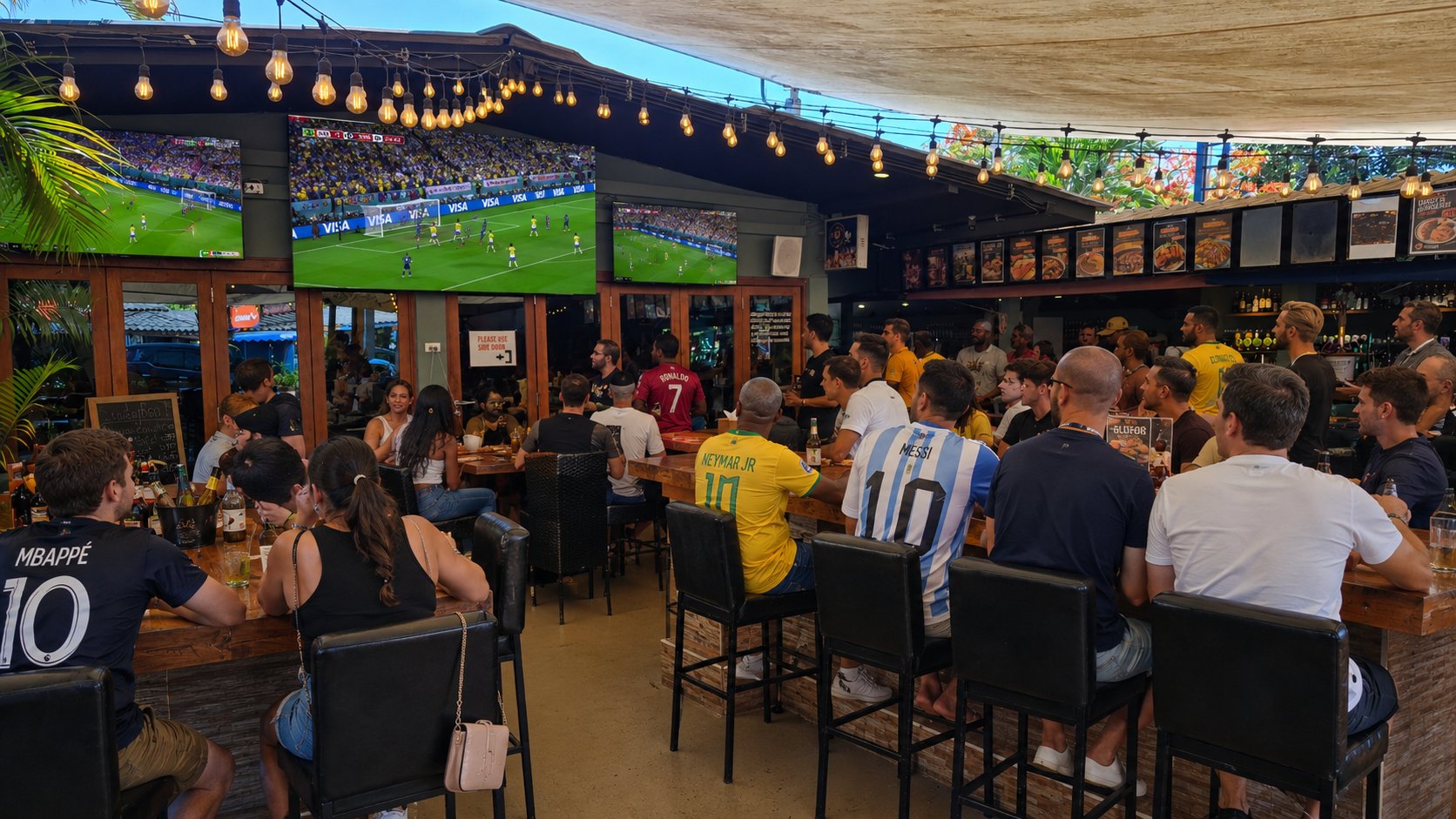 Outback covered garden bar with string lights and big sport screens